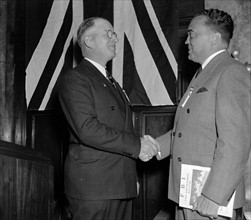 J. Edgar Hoover is greeted by Arthur Muchow