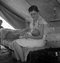 Young migrant mother with six weeks old baby born in a hospital with aid of Farm Security Administration (FSA) 19380101