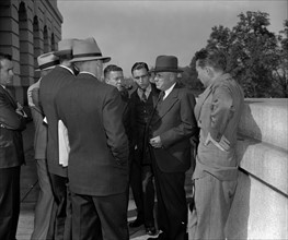 Sam Rayburn, Majority Leader of the House, holds an informal press conference outdoors. 19390101