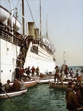 Disembarking from a ship, Algiers, Algeria, 1899.