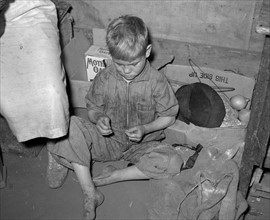 Son of white migrant worker in tent home near Harlingen, Texas 19390101