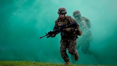 Photograph a US Marine and the Royal Brunei Land Forces conducting Military Operations in Urban Terrain training during Cooperation Afloat Readiness and Training