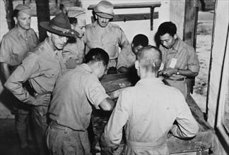 Photograph of Lieutenant-General Stilwell inspecting a motor school at the Chinese-American training centre