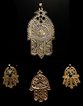 Gold palm shaped amulet, known as, the Hamsa throughout the Middle East and Africa