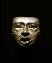Greenstone mask of a mythical dignitary ancestor, or captive from Mexico