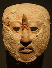 Ceramic mask with scars on it from Campeche, Mexico