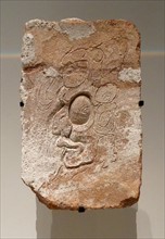 Clay brick with the face of the Sun God from Tabasco, Mexico