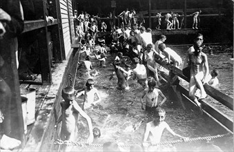 City children in free bath at the Battery, New York City, USA.