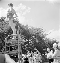 Washington, D.C. Publicity photographer at swimming pool.