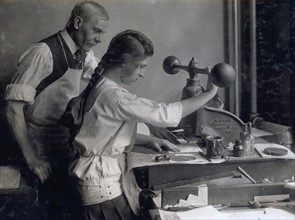 Girl working in a print making workshop, New York 1900