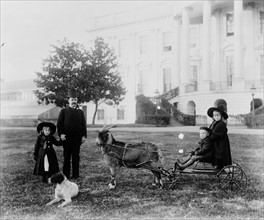 Photograph of Major Russell Harrison outside the White House playing with his children