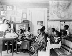 Photograph of young students in a classroom at the Tuskegee Normal Industrial Institute