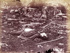 Photomechanical print of a deceased sharpshooter during the Battle of Gettysburg