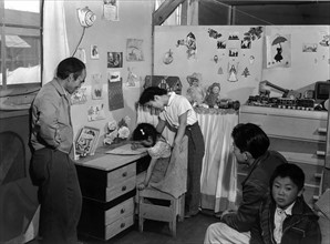 Photographic print of Tojo Miatake and family at the Manzanar Relocation Centre, California