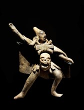 ceramic figurine of a Mayan warrior,