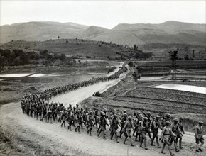 photographic print of Chinese soldiers marching on road in Burma Road heading toward the Salween front