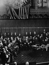 Theodore Roosevelt in Guildhall seated next to the Lord Mayor and surrounded by the Common Council. 1910.