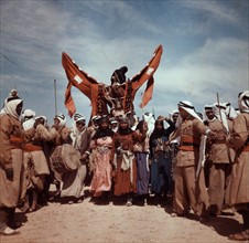 Romani Gypsy men and women, staging a Bedouin wedding, Syria 1938