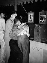 Young boys looking at nude dancer in the penny movies at south Louisiana state fair 1945
