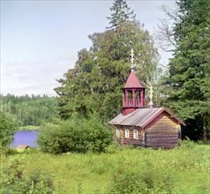 Russian country scene with traditional wooden Church 1905