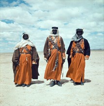 Three Bedouin men, standing, facing front, 1938.