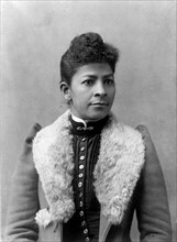 African American woman, half-length portrait, facing slightly right).