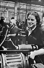 Women handling lathe in a factory in the USSR during world war two.