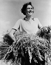 American woman working on a farm during world war two 1942