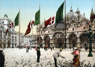 Feeding Pigeons in St Mark's square Venice, Italy 1900