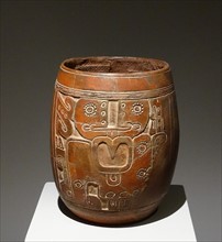 Mayan ceramic vase, with an engraved figure of a god with a large nose