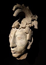 Mayan stucco head of a youth. From a funerary chamber