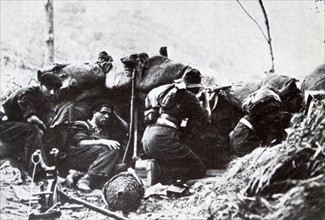 Republican soldiers shelter in a trench