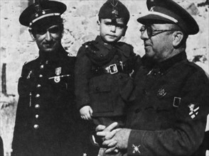 1936 Toledo, General Moscardo holding up the child Restitutus Alcazar, born during the siege