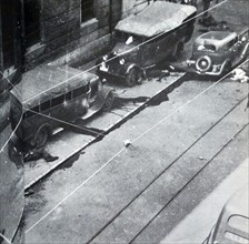 casualties and injured lie on the streets during the Siege of Gijón, in the Spanish Civil War