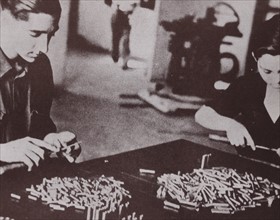 man and woman in munitions factory during the Spanish Civil War