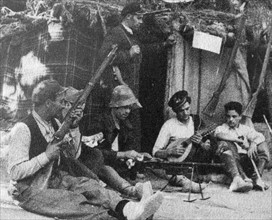 soldiers playing music during a break in hostilities during the Spanish Civil War
