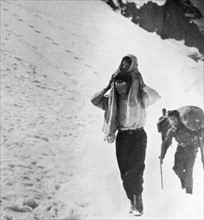 Refugees cross snow covered mountains, during the Spanish Civil War