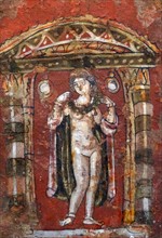 Aphrodite in a shrine adorning herself with a necklace