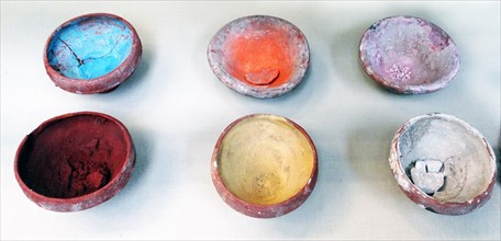 Pottery bowls containing coloured paints