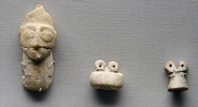 Sumerian stone head and eye figurines made of glazed faience and clay. From the Eye Temple, Tell Brak, Syria