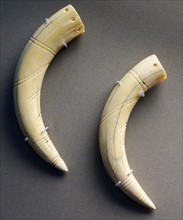 tusks made of ivory or bone in the shape of the incisor teeth of a hippopotamus, Egyptian 3000-2600 BC