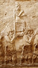 attack on an enemy town Below: removal of enemy gods, Assyrian, about 745 BC From Nimrud