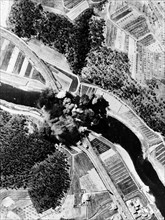 Allied bombers blow up a Nazi bridge near Florence