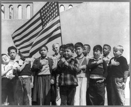 Children at the Weill public school for the international settlement saluting the flag