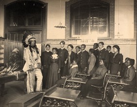 Louis Firetail (Sioux, Crow Creek), wearing tribal clothing