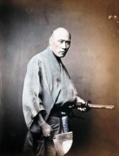 Japanese man in Kimono with sword 1890