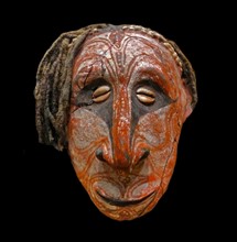 Head made from clay, painted to represent an ancestor figure. Papua New Guinea 1912