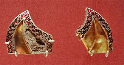 Anglo Saxon metalwork; 5th-6th Century AD. Pair of mounts, decorated with cloisonné