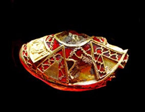 part of the boss from a shield, the lid to a Christian chalice, or the stopper to a drinking horn. Staffordshire Hoard. Anglo-Saxon.7th or 8th centuries