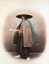 Felice Beato; portrait of a Japanese samurai, in traditional dress. 1863-68